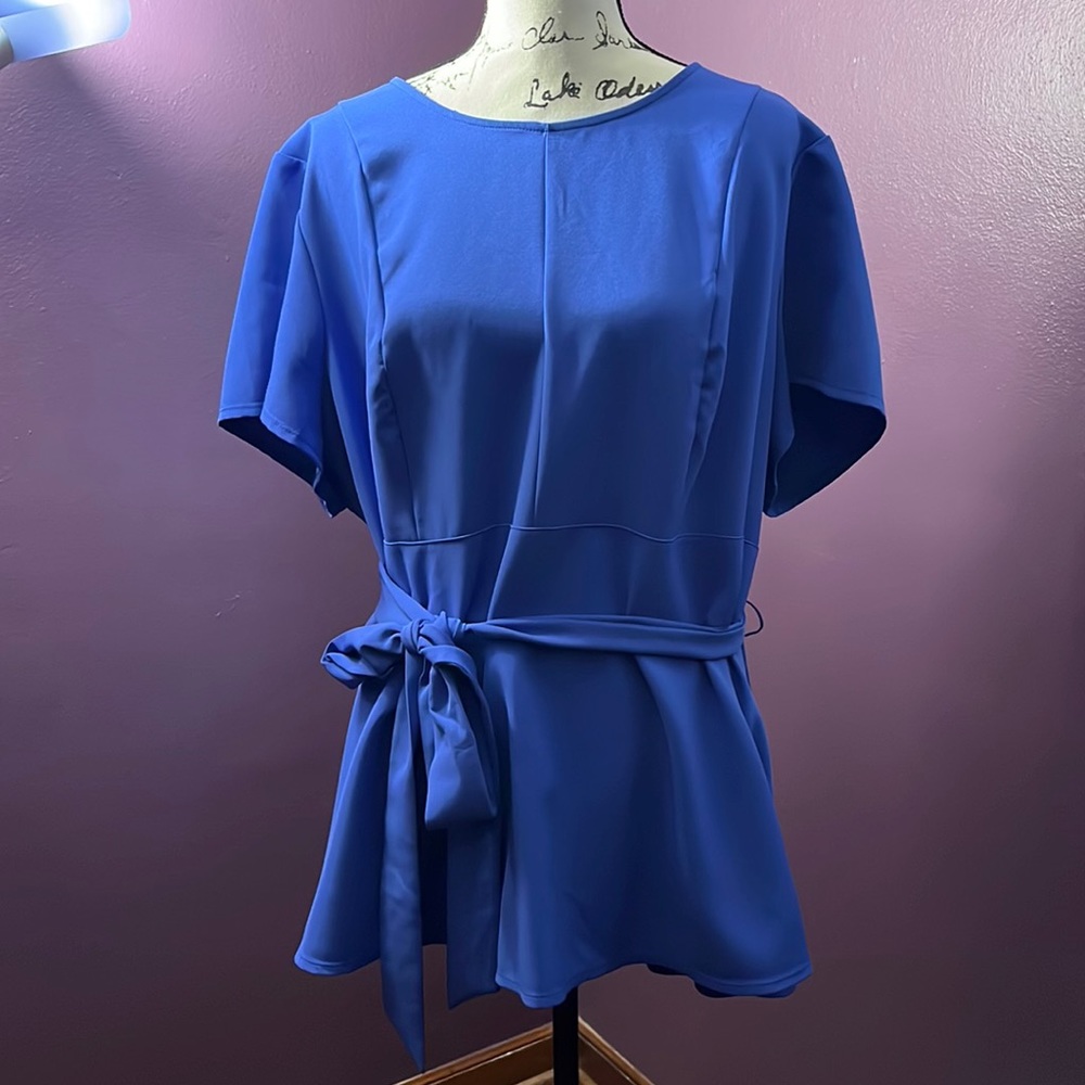 Beautiful periwinkle belted blouse. Only worn a couple of times.